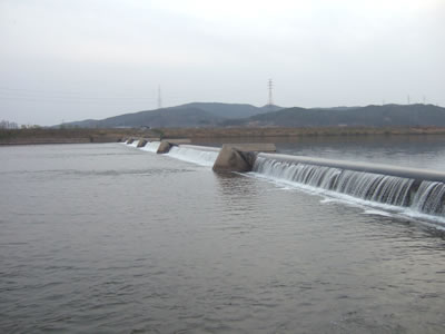 long rubber dam is stretching across the river