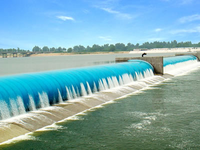 Blue water inflatable rubber dam with overflow is under the piers.