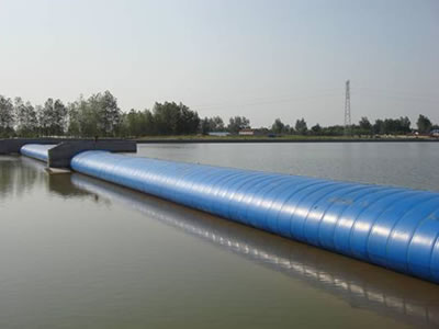 Air inflatable rubber dam is in front of the bridge, upstream and downstream are water.